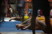 Bodies form a mass spectacle during rolling for Thimithi festival.The sri Mariamman  temple and the Hindu sub culture is an colourful display that intrigues and enchants tourists to the out of the way find in Singapore: by andrewnomad, Views[432]