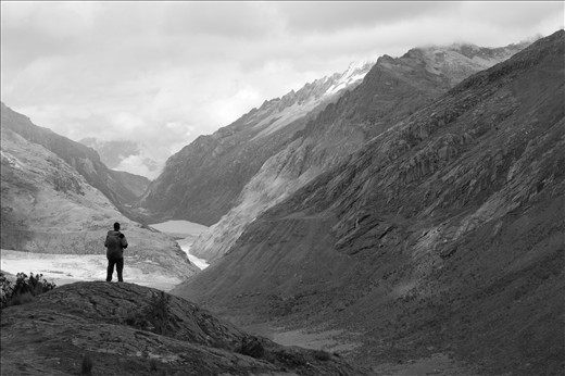 As the group began to make their way down to the valley from the high pass, the campsite could finally be seen in the distance. - Santa Cruz Trek, Huaraz, Peru