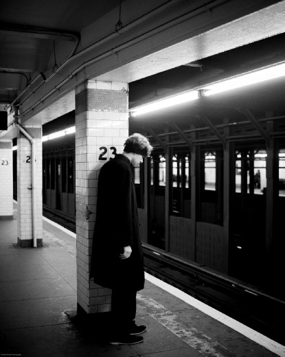 The Pillars of Society - 

As I continue my journey I arrive at the 23rd Street Station. A lone figure stands leaning against the pylon holding up the city, keeping it from falling down. 
