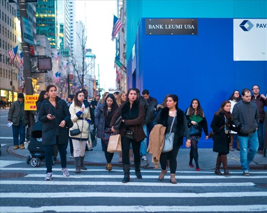 A Sea of people - clutching paper bags, expensive handbags as they shuffle from store to store.