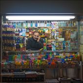 A man in his little booth, so full of colour and life, matching the smile on his face.: by andrewphan, Views[218]