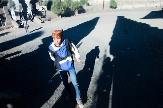 Bromo Villagers (The Tenggerese) walks past Pura Luhur Poten (Temple) Gate. Pura Luhur Poten is a Hindunese temple in the crater where the Tenggerese held ceremony to pray their god and the mountain. 
