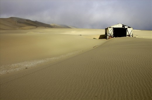 The cost of cleaning up the desert is too high so the buildings have been left to slowly rot away