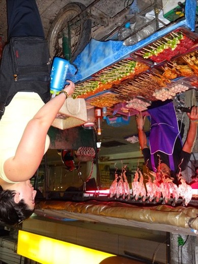 Street vendor:  first meal in Thailand consisted of beef and pork on a stick with a tomato, piece of pineapple and jalapeno.  delicous  (for some reason, I cant rotate the photo  SORRY!)
