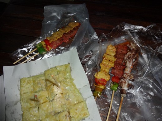 Beef, chicken, and octupus skewers for dinner.  For dessert, a banana pancake.  
