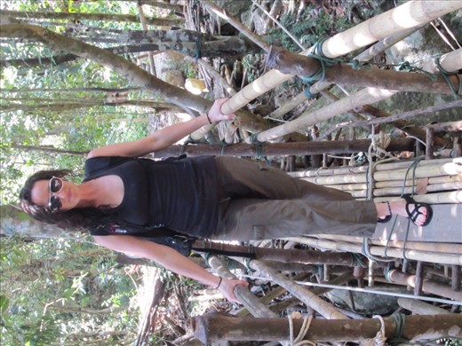 The bridge is literally bamboo sticks held together by ropes.  When it looks like there's a weak spot, they must just put another row of bamboo..  Scary but so worth it.