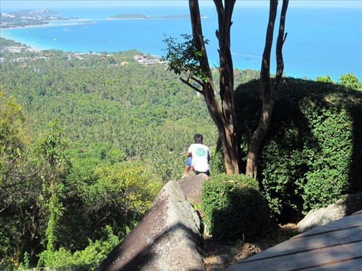 Am employee of the restaurant.  He leaped from the deck to this rock to prune this bush.  I couldn't believe it.