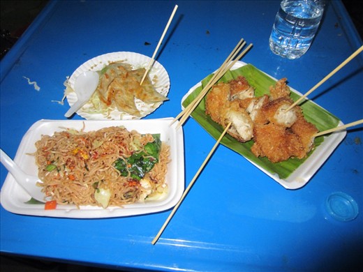 Dinner at the market:  fresh potstickers, fried chicken, stir fried noodles, pineapple (not pictured).