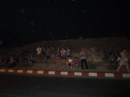 limited seating without spilling onto the street so people just hung out on the median (there's actually a moat behind them).