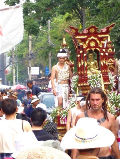 There were several processions on the first day of Songkran.  Each had a Buddha figure that locals would throw water or oil on.
