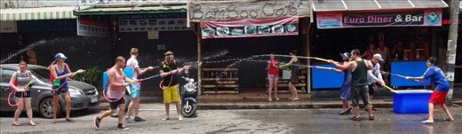 Water war!  This area is where lots of tourists stay.  Not many locals on this street for Songkran.  