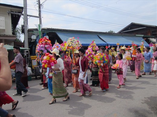 We saw two of these processions while we were in Pai.  It started at the local temple.  During school breaks, families send their sons, ages 7-11, to the temples to learn Buddhism.  The procession is the celebrate the completion of their stay.