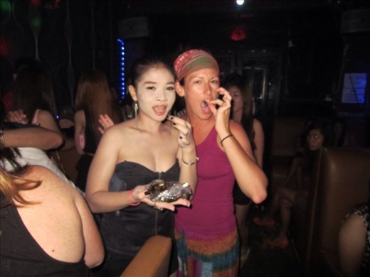 I tried a scorpion, we both tried frogs.  Might as well try a new local delicacy.