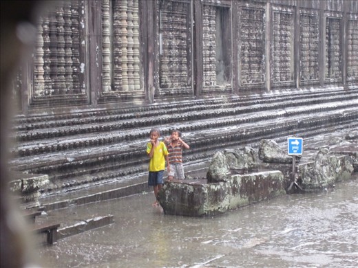I don't normally like to take photos of the kids in these countries.  But, this was a candid shot.....they were walking around Angkor Wat in the rain while everyone else was huddled inside.