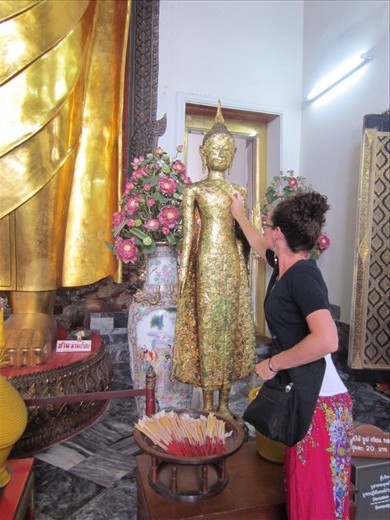 We each put a piece of gold on this Buddha for good luck.