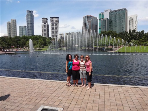 At the plaza of the Petronas Towers, where the aquarium is located.  What this photo doesn't show, is that as we're taking this photo, there is an Asian guy right next to Sadie.  His friend is taking a picture of him with us......but not really with us.  So, we all gathered round him and took a real photo with him.  This has happened several times to Jennifer and I.  So bizarre.