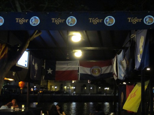 Texas flag next to the Singapore flag