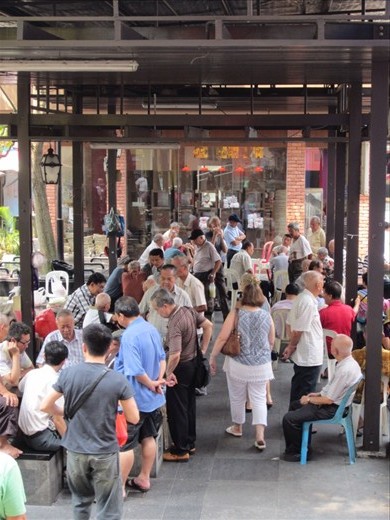 Men playing checkers in Chinatown