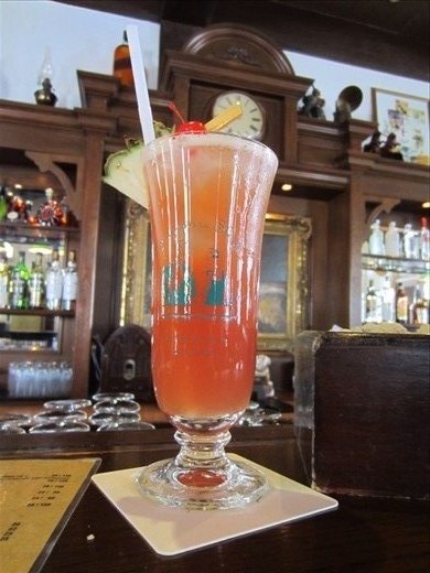 Singapore Sling at the spot where it originated, The Raffles Hotel.  Created between 1910-1915.  Good drink.  Not worth $26, not including tax and service charge!  Plus, I'm a vodka-kind of girl.