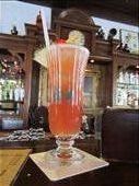 Singapore Sling at the spot where it originated, The Raffles Hotel.  Created between 1910-1915.  Good drink.  Not worth $26, not including tax and service charge!  Plus, I'm a vodka-kind of girl.: by anealis314, Views[366]