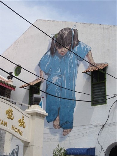 I read an article about an artist who paints murals on the walls of Georgetown.  So I spent one day in search of them all.  Sadly, several have been vandalized.  