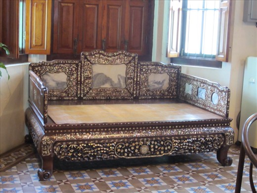 Items at Pinang Peranakan Museum.  The Peranankan's were wealthy Chinese people who settled on Penang Island (where Georgetown is located) and left behind significant cultural influences that are still alive in Penang today.  

This is an opium bed.  As in, this is where they sat and smoked opium.  