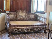 Items at Pinang Peranakan Museum.  The Peranankan's were wealthy Chinese people who settled on Penang Island (where Georgetown is located) and left behind significant cultural influences that are still alive in Penang today.  

This is an opium bed.  As in, this is where they sat and smoked opium.  : by anealis314, Views[1430]