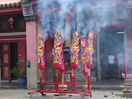 There is always something burning in the places I've visited, so I wasn't  surprised when I smelled smoke.  But then I saw these things burning in the street in front of a temple.  I asked a couple what these were for and they told me it was a goddess's birthday.  There were hundreds of candles lit inside the small temple as well.