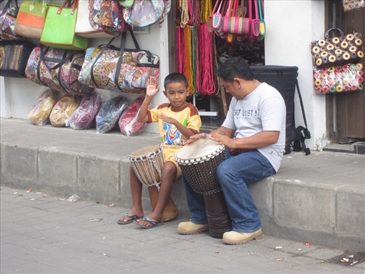 little guy learning to play the drums