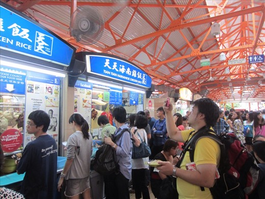 There are about 50 stalls in this food hawker center.  Ninety percent of them serve Hainese chicken (chicken and rice dish).  How do you choose the best one?  The one with the most Asians waiting in line!