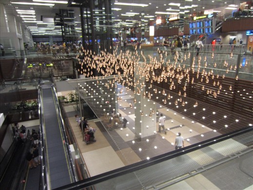 installation at the Singapore airport.  These gold balls are on strings and they move in different formations. 