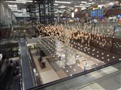 installation at the Singapore airport.  These gold balls are on strings and they move in different formations. : by anealis314, Views[797]