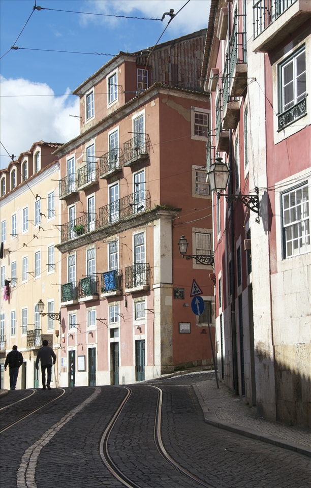 What Lisbon gives me is magical. There are some places, where you can’t explain what you feel, because it’s just a feeling. Lisbon is one of those. It’s not just a city, it’s a mixture of art, history, people, culture. The spirit, which flies over it, is what makes is so special. To walk on the streets, to meet all these people, without knowing them, without understanding their language, but still feeling the emotions on their faces, to inhale every little detail from those stunning buildings. Masterpiece of architecture, filled with history. 
How many people have walked on that street? How many souls have been here? Every one of them is a piece of this city. The people - that’s what gives a city it’s final ingredient. And the buildings? They just keep standing there, watching, being pretty. They just keep imbibing pieces of those souls and then keep telling stories to strangers like me. Because these buildings - they are speaking, they are so filled with memories and feelings, that’s impossible not to feel them.