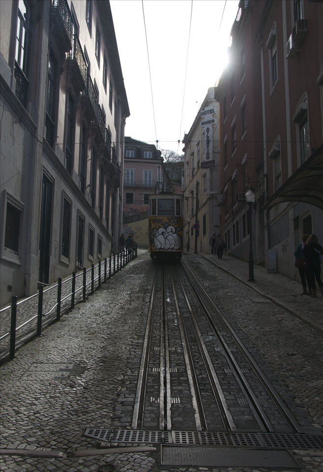 Because so many people go through cities like Lisbon. So many different personalities have been on that train. Yes, on exactly this one, on this steep street. Going somewhere. Everybody so purposeful. Everybody has no time to appreciate, everybody has no time to see. Because the people, who live in Lisbon, are the one, who are blind to it’s beauty. They don’t have time, they are busy traveling. They are busy going somewhere. They are always on their way on the steep street. In the rush, they only see the graffiti, but they don’t know how much it meant for someone to draw them. They don’t know how lonely this train feels. They are in a hurry.