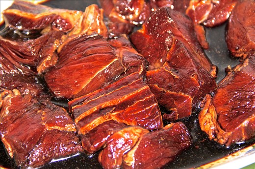 Marinate beef with pepper, sauces and coriander powder for about an hour.