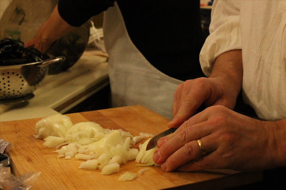 My father chopping onions in our family kitchen. 