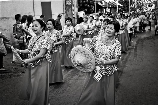 women dancing on a parade for their yearly celebration for good harvest