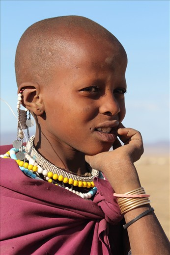 This Masai girl has followed in the footsteps of her father and brother herding the goats and cattle. School is of very little interest to her as farming is her main priority.