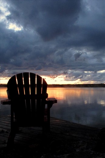 This chair overlooking Lake Kagawong is empty because if we sit idly by we will miss the beauty of what the world has to show and teach us! 
