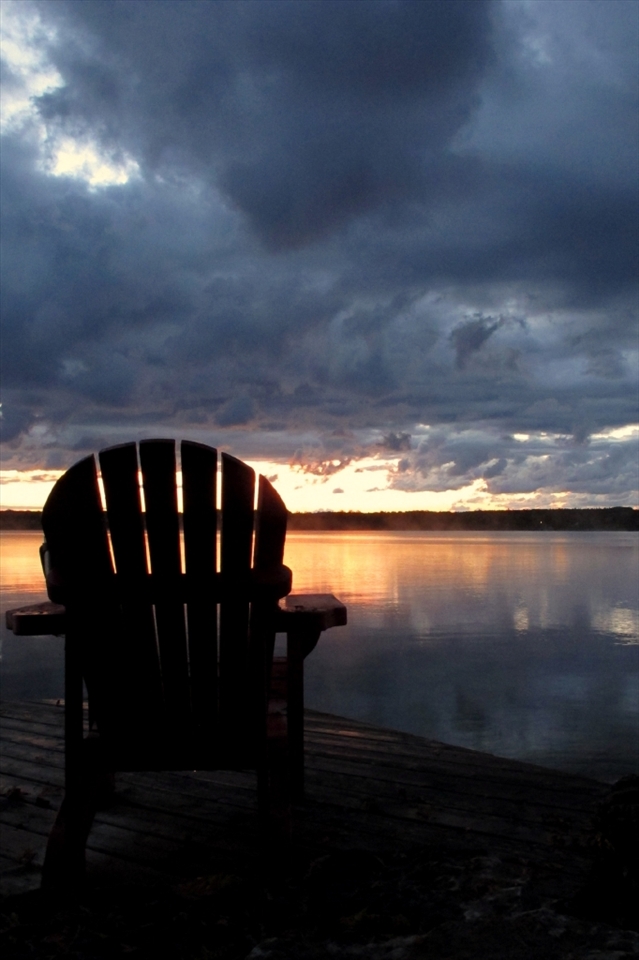 This chair overlooking Lake Kagawong is empty because if we sit idly by we will miss the beauty of what the world has to show and teach us! 