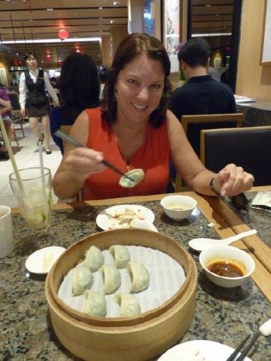 Rice noodles, steamed dumplings, and lemon grass iced tea in Singapore.
