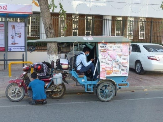 A tuk-tuk for hire.  There appeared to be about 5 billion of these operating in Cambodia