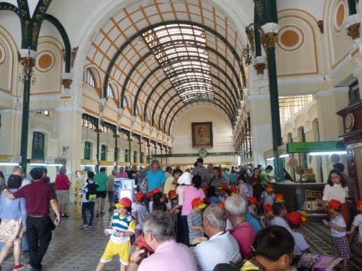 School children in the colonial French post office, Saigon