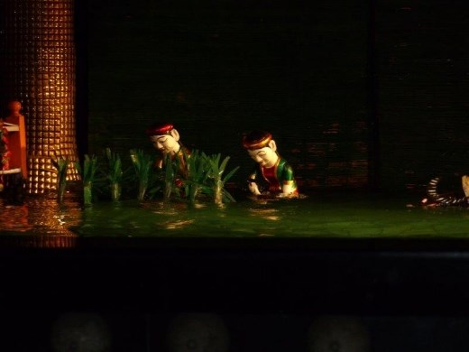 Water puppets planting rice.