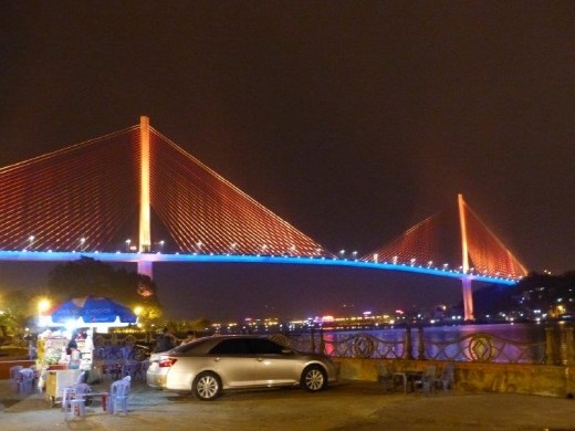 Bridge over Ha Long Bay, changing colors all night long