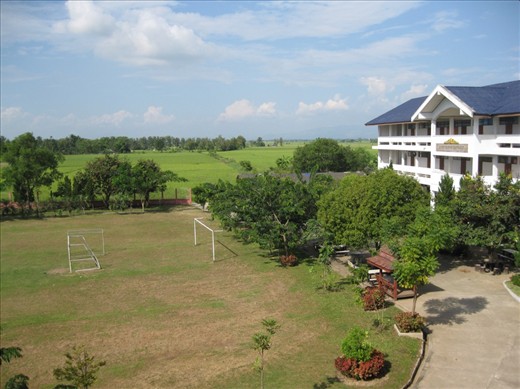 Rural Thailand school surrounded by rice fields