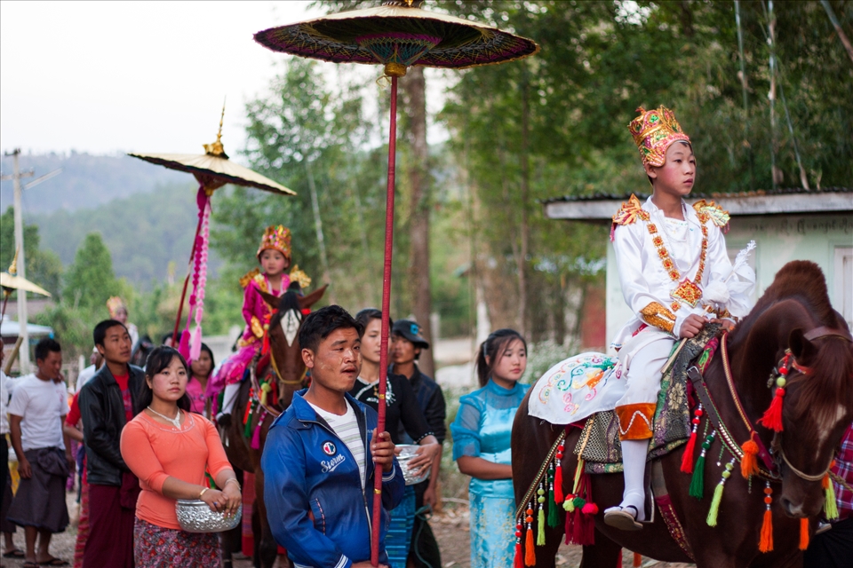 As the parade draws to an end, tired faces cover the crowds. But the anticipation of the novices never resides. They only grow more nervous, as they glance from their thrones to the surrounding children. As they enter the monastery, their heads are shaved, their jewels stripped, and they are given traditional robes to wear. Tibetan red for boys, and honey pink for girls. They become almost unrecognisable to their families, and with their innocent eyes clutching memories from home, they begin to pray, to collect alms and to work in the monastery.