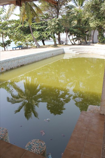 The pre-war Lodge Pool is green from washing tools that will re-rehabilitate it.