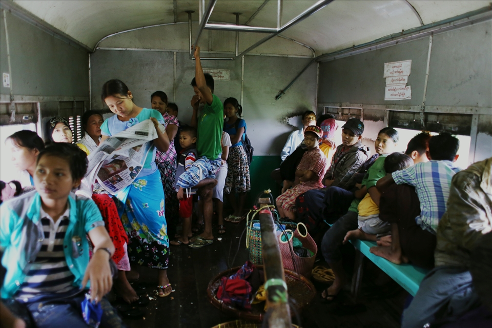The Yangon Circular Railway takes three hours to loop around the city. It’s a muggy 30-degree day when I purchase my ticket, and an attendant excitedly tells me that the carriages are “air-conditioned”. I find out later that this is in the form of open windows and spluttering, tired roof fans that do nothing more than add to the cacophony. A policeman half-heartedly taps one of the fans with his baton each time it drifts to a halt.