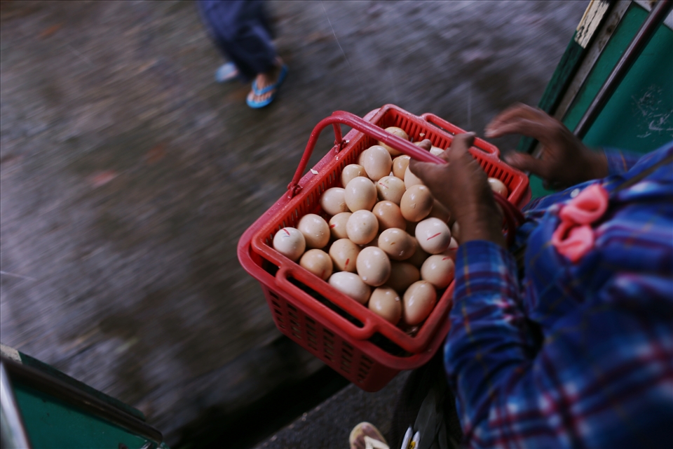 The carriages are filled with vendors peddling their wares: bananas, newspapers, tobacco, smoked fish, chicken and quail eggs, lurid melting icy poles in clouded plastic bags. As the train approaches each station, more traders run along the platform. Before the train has stopped they mount the steps with dexterity and begin singing and shouting at anyone who will listen.